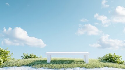 Fototapeta premium Minimalist white bench on a green grassy hill under a bright blue sky with soft clouds.