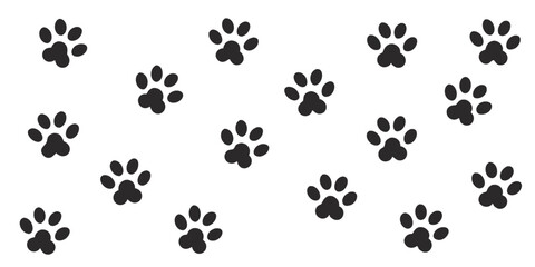 Fototapeta premium Set of black paw prints animal tracks on a white background