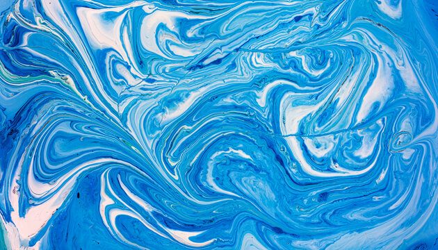Dynamic blue waves create mesmerizing abstract ink art
