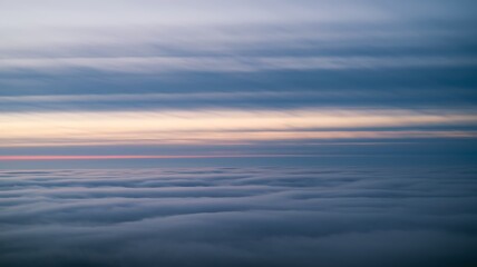 Overcast sky with soft, diffuse light creating a moody atmosphere. Gentle cloud coverage, muted tones, and subtle illumination evoke serenity and tranquility in nature.