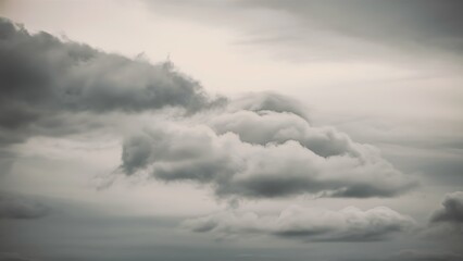 Obraz premium Soft gray clouds blanket the sky on a cloudy day, creating a serene atmosphere perfect for capturing the beauty of nature's tranquil moments.