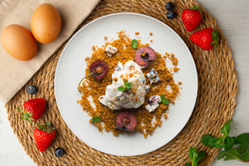 Yogurt ice cream with cherry and cookie. Top view table.