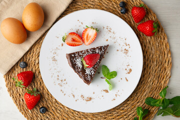 Chocolate cheesecake with fresh strawberries. Top view table.