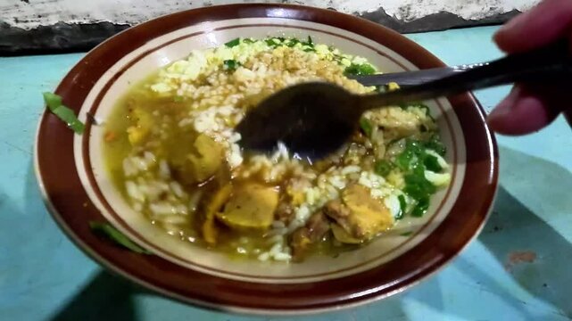 A plate of soto babad. Soto babad is Indonesain beef soup with innards