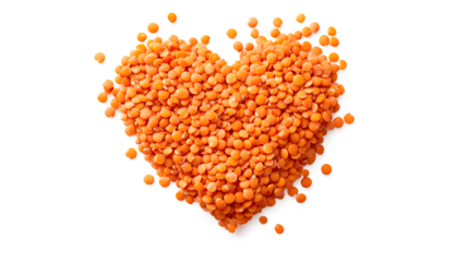 A pile of red lentils is arranged in the shape of a heart