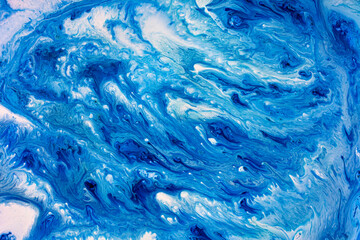 Beautiful abstract ink design with swirling blue waves
