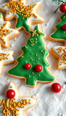 decorated christmas cookies on a white table cloth