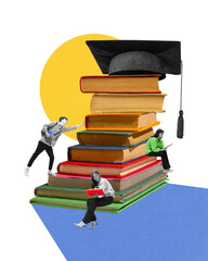 Students studying near massive stack of books crowned by graduation cap, preparing for finals....