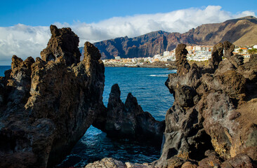 Charco La Vaca in Tenerife, Spain. Charcos Los Turistas park with lava rock formations and cave in...