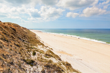 Tourists strolling along Sylt beach