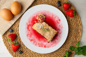 Delicious homemade raspberry crumble tart. Top view table.