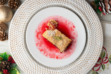 Delicious homemade raspberry crumble tart. Top view table with christmas decorations.