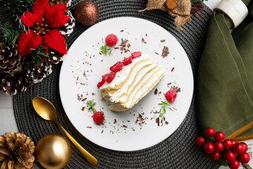 Milecrepe tart. Crepe and cream cake decorated with lime and raspberries. Top view table with christmas decorations.