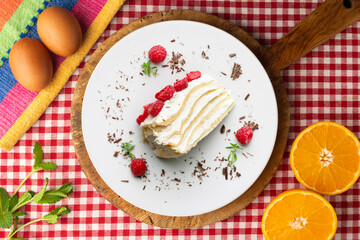 Milecrepe tart. Crepe and cream cake decorated with lime and raspberries. Top view table.