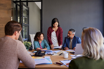 Multiethnic business people discussing project in a meeting room