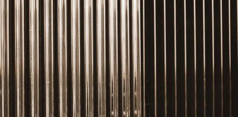 Abstract Metallic Vertical Lines Close-Up Symmetrical Perspective Minimalistic Warm Toned Texture Pattern Intensity Background