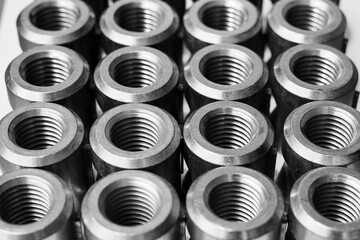 Array of metal threaded pipe fittings