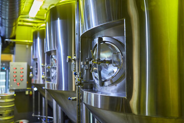 Stainless Steel Fermentation Tanks in a Brewery