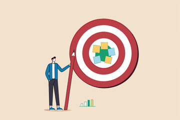 Goal setting, achievable target or purposeful objective, mission to accomplish or challenge to win for business success concept, businessman write down goal on notes and put on big dartboard target.