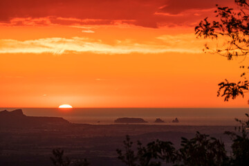 Sky tinged red at sunrise next to the Medes Islands in Catalonia