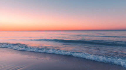 Fototapeta premium Pink Sunset Seascape: Serene Ocean Beach at Dusk