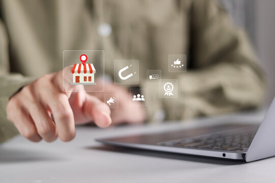 Local marketplace E-commerce concept. Person use laptop with local marketplace icons. Local seo strategy, local search optimization, small business and retail.