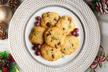 Handmade chocolate chip cookies. Top view table with christmas decorations.