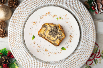 Delicious lemon and poppy seed cake. Top view table with christmas decorations.
