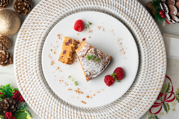Whole wheat vegan cake with fresh fruit. Top view table with christmas decorations.