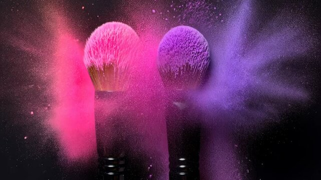 Colorful makeup brushes releasing vibrant powders against black background  