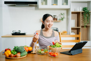 Young woman as she prepares healthy recipes with fresh fruits, vegetables, and nutritious ingredients. an Clean eating , healthy lifestyle.
