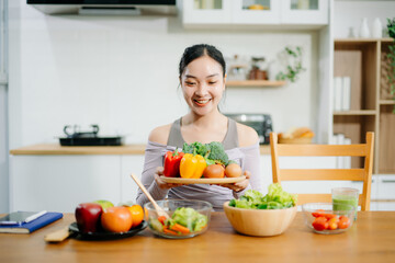 Young woman as she prepares healthy recipes with fresh fruits, vegetables, and nutritious ingredients. an Clean eating , healthy lifestyle.