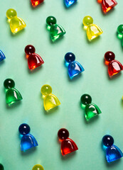 Multi-colored figures of people on a turquoise background. Concept of sociology, psychology,...