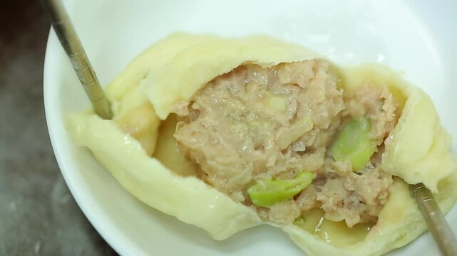 Steamed mandu on a white plate