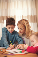 Family at home. Shallow DOF. Developed from RAW; retouched with special care and attention; Small...
