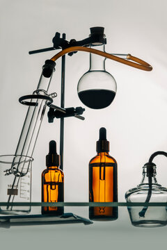 Laboratory setup with glass bottles and equipment for fragrance invention