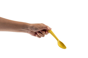 Yellow spoon and hand isolated on transparent background.