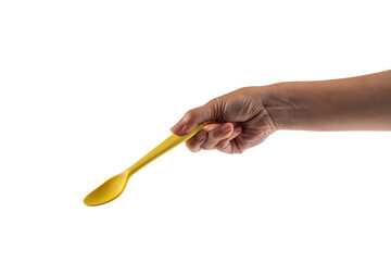 Yellow spoon and hand isolated on transparent background.