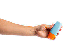 Blue cosmetic bottle in hand, Skin care or sunscreen cosmetic on transparent background.