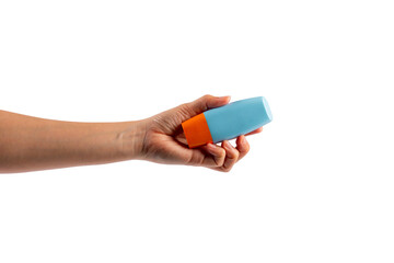 Blue cosmetic bottle in hand, Skin care or sunscreen cosmetic on transparent background.