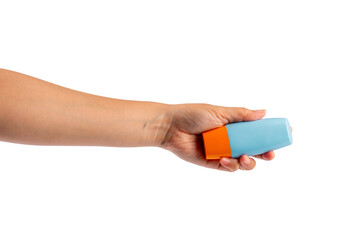 Blue cosmetic bottle in hand, Skin care or sunscreen cosmetic on transparent background.