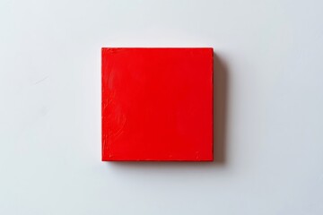 Vibrant red square painting on a clean white background, showcasing modern art and minimalist aesthetics