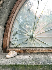 Broken glass with stone