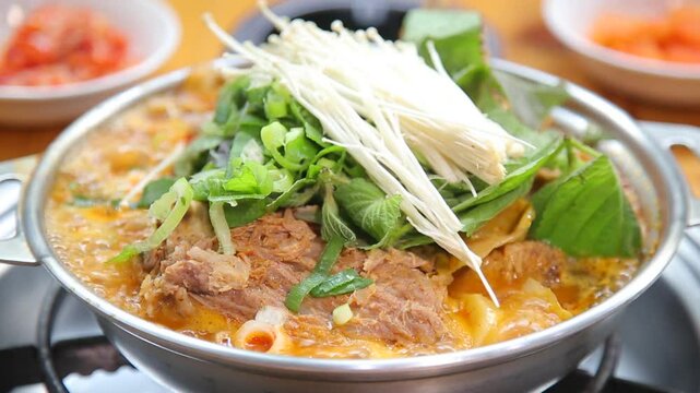 Pork backbone stew with perilla leaves and enoki mushrooms