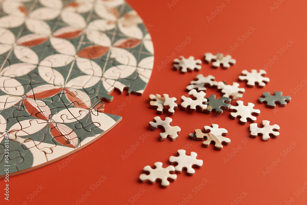 Poster partially completed jigsaw puzzle with floral pattern on red background, showcasing problem-solving,