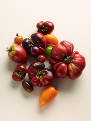Sweet farm tomatoes over beige background