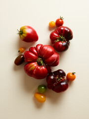 Sweet farm tomatoes over beige background