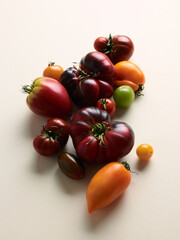 Sweet farm tomatoes over beige background