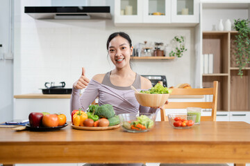Fit woman enjoys healthy fruit breakfast after yoga training. fitness, nutrition, healthy lifestyle.