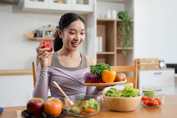 Fit woman enjoys healthy fruit breakfast after yoga training. fitness, nutrition, healthy lifestyle.